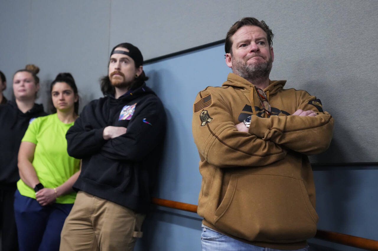 Seattle Seahawks general manager John Schneider (right) listens as head coach Pete Carroll speaks during a media availability after it was announced Carroll will not return as head coach next season at the NFL football team’s headquarters Wednesday in Renton. (AP Photo/Lindsey Wasson)
