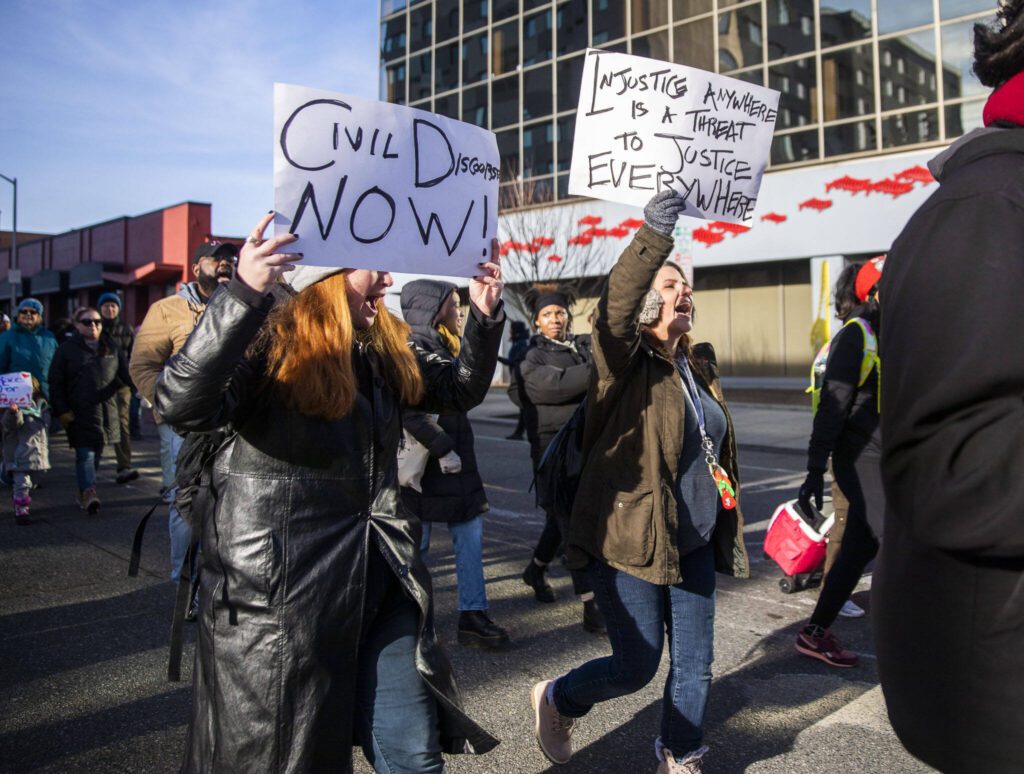 People march and chant during Snohomish County Black Heritage Committee’s annual Martin Luther King Jr. Day march on Monday, Jan. 15, 2024 in Everett, Washington. (Olivia Vanni / The Herald)
