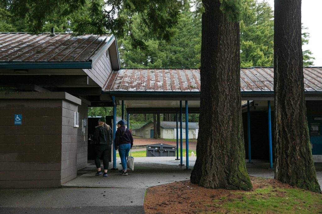 Emma Titterness and Liz Skinner walk around Thornton A. Sullivan Park at Silver Lake while searching for people to interview for a point-in-time count Tuesday, Jan. 23, 2024, in Everett, Washington. (Ryan Berry / The Herald)
