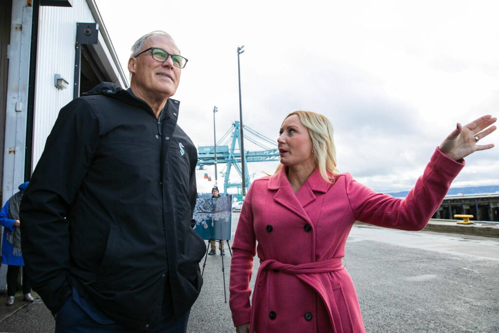 Gov. Jay Inslee and Port of Everett CEO Lisa Lefeber take a look at Pier 3 while discussing future plans for the Port of Everett Seaport on Wednesday, Jan. 17, 2024, in Everett, Washington. The Port is raising funds to renovate Pier 3 and make it capable of charging electric vessels. (Ryan Berry / The Herald)
