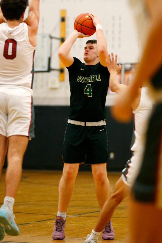 Marysville Getchell’s Wyatt Harris shoots a three against Cedarcrest on Tuesday, Jan. 16, 2024, at Cedarcrest High School in Duvall, Washington. (Ryan Berry / The Herald)
