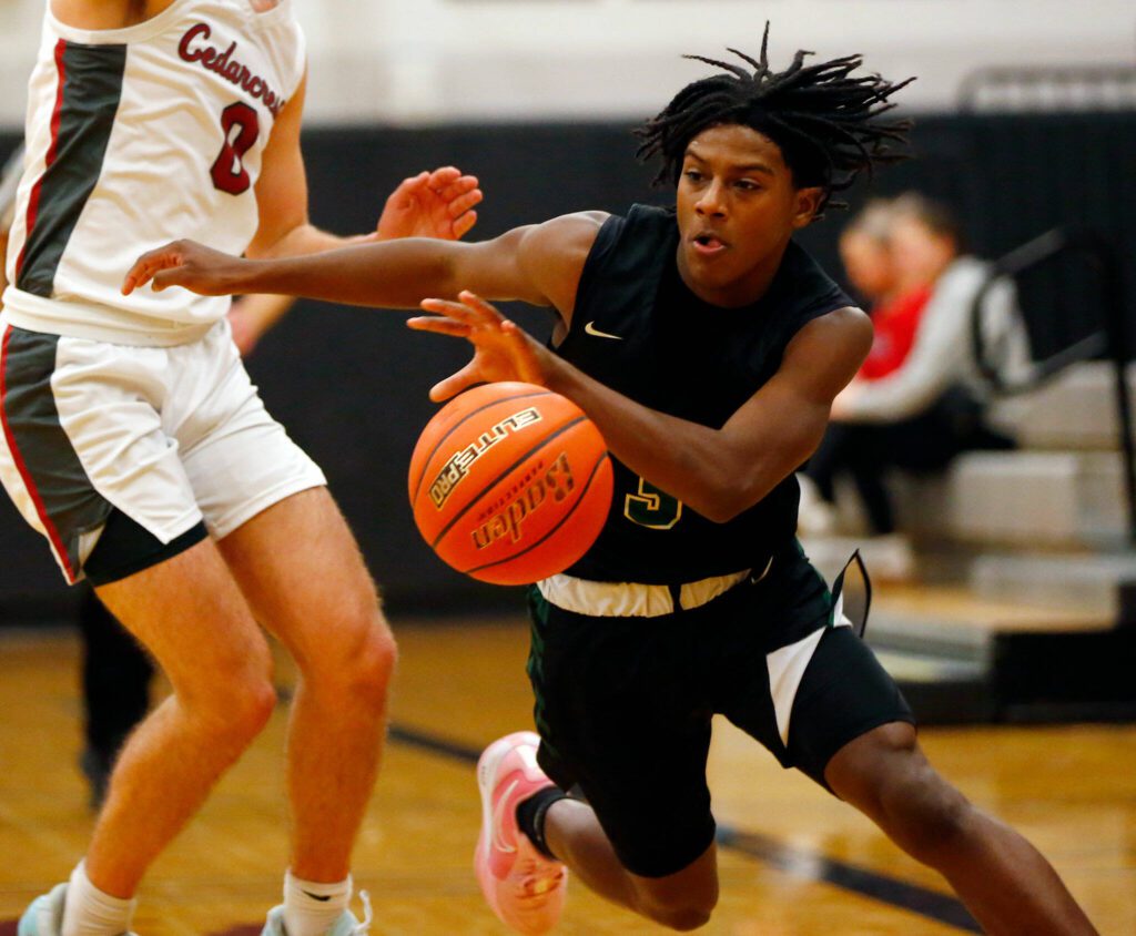 Marysville Getchell’s Shawn Etheridge gets the ball up the court against Cedarcrest on Tuesday, Jan. 16, 2024, at Cedarcrest High School in Duvall, Washington. (Ryan Berry / The Herald)
