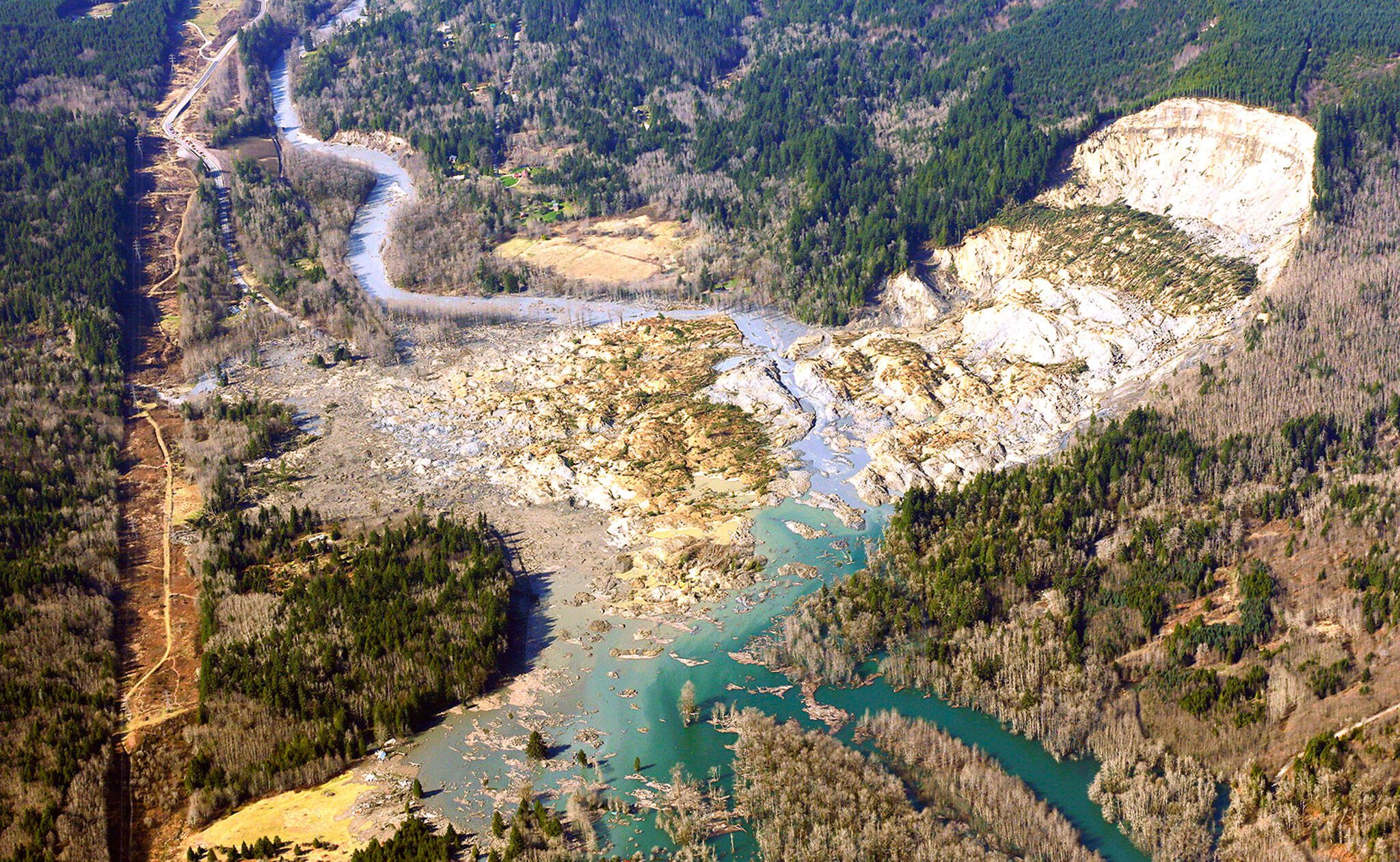 The massive slide that killed 43 people is shown in a 2014 aerial photo taken two days after it occurred near Oso, Washington. (AP Photo/Ted S. Warren)