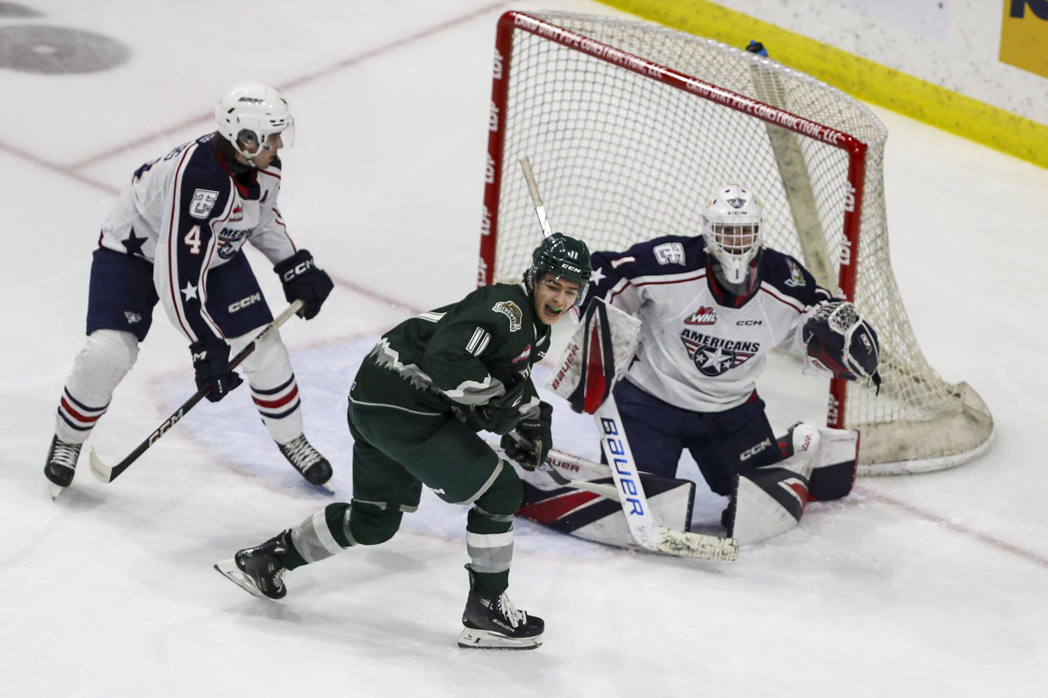 Silvertips’ Carter Bear (11) reacts to a goal during a game against the Tri-City Americans on Sunday at the Angel of the Winds Arena in Everett. (Annie Barker / The Herald)
