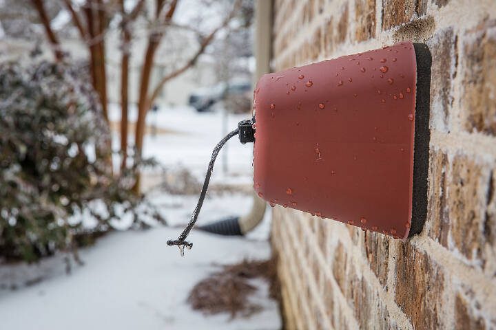 An outdoor faucet is covered to protect it from freezing temperatures. (Getty Images)