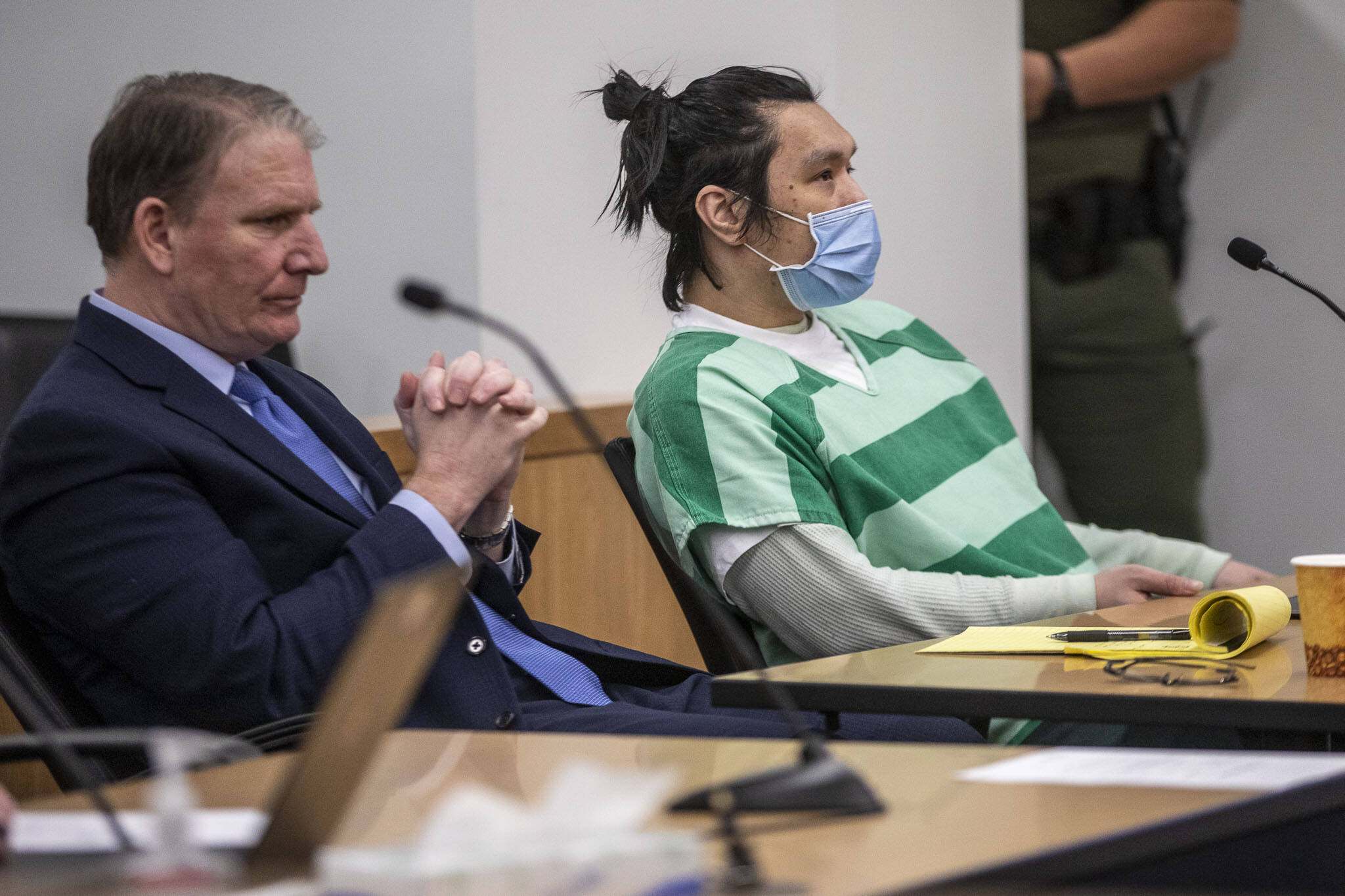 Khoa Nguyen listens during his sentencing at the Snohomish County Superior Courthouse on Wednesday, Jan. 24, 2024. (Annie Barker / The Herald)