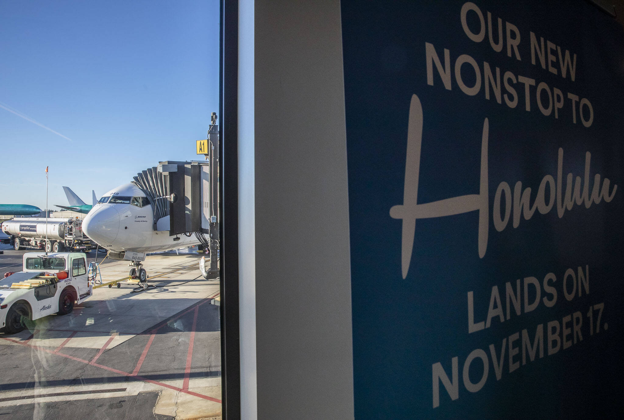 The first flight from Paine Field to Honolulu is prepared by grounds crew on Friday, Nov. 17, 2023 in Everett, Washington. (Olivia Vanni / The Herald)