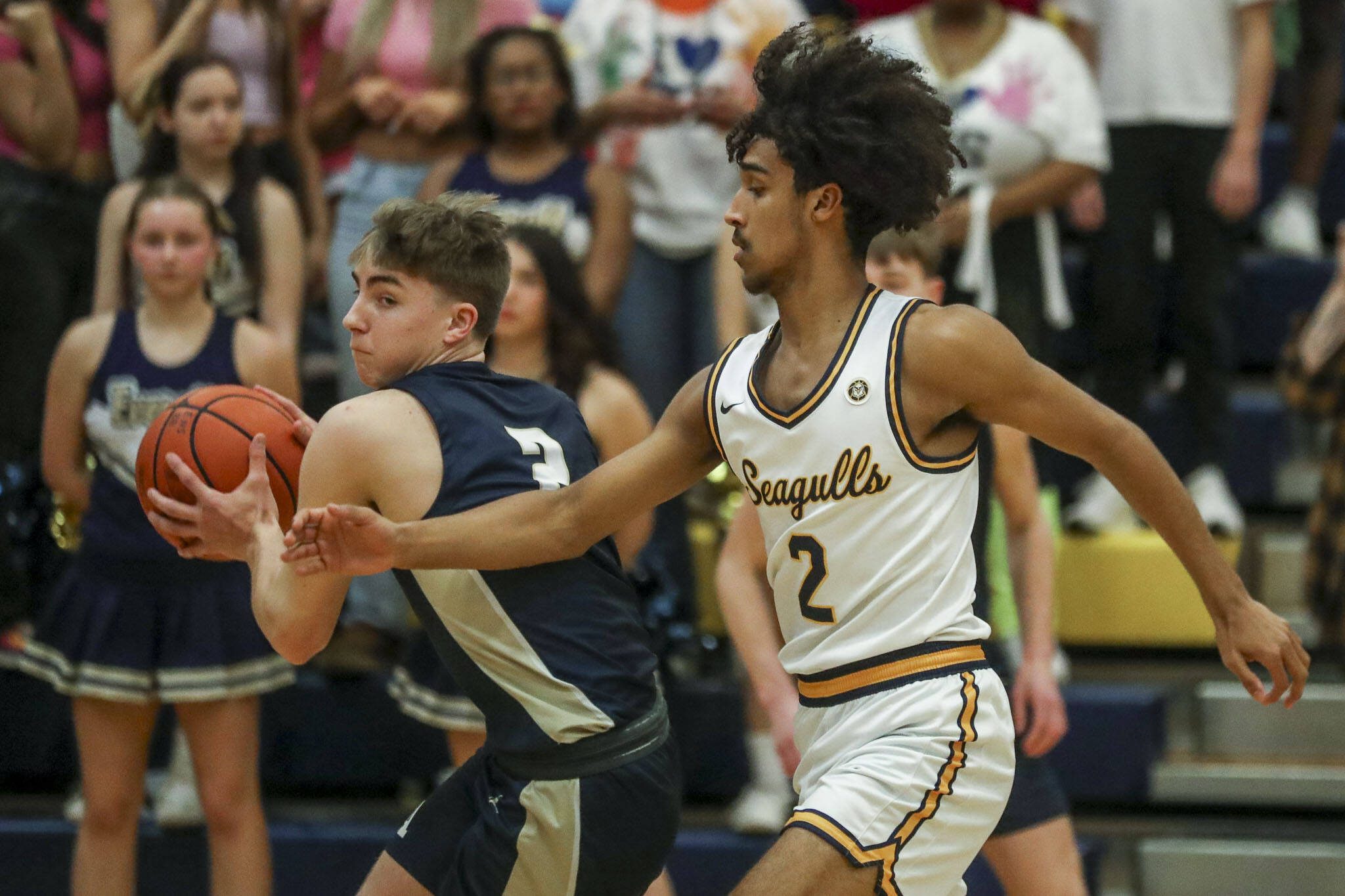 Arlington’s Leyton Martin (2) moves with the ball during a game against Everett on Friday at Everett High School.(Annie Barker / The Herald)
