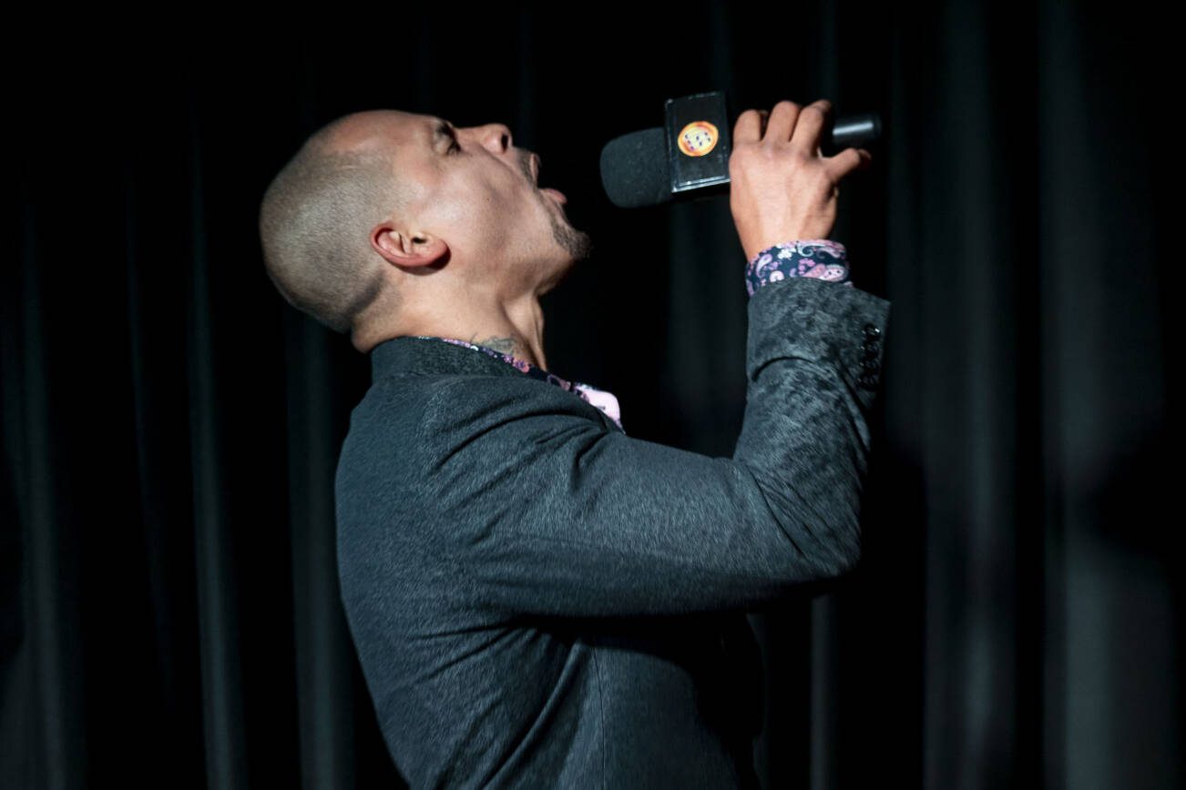 Washington Wolfpack head coach JR Wells howls during the Everett AFL team unveiling at Tony V's Garage in Everett, Washington onThursday, Oct. 26, 2023. (Annie Barker / The Herald)