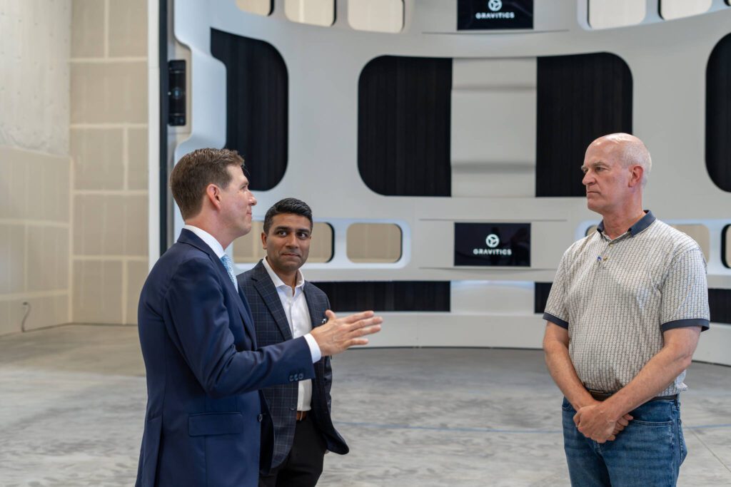 U.S. Rep. Rick Larsen, right, speaks with Gravitics’ executives Mark Tiner, left, and Jiral Shah, center, on Aug. 17, 2023, at the company’s Marysville facility. (Gravitics.)
