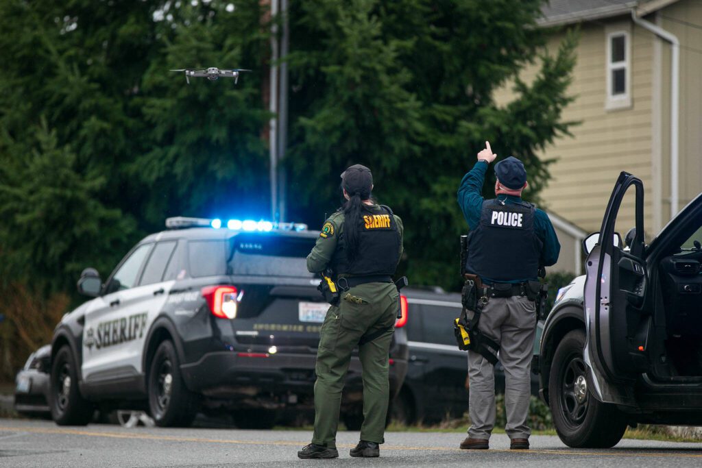 Law enforcement send up a drone during a police standoff Wednesday, Jan. 31, 2024, in south Everett, Washington. (Ryan Berry / The Herald)
