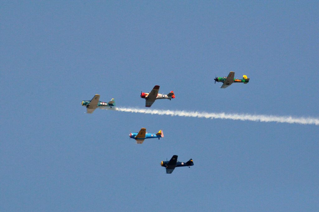 The Cascade Warbirds fly over Naval Station Everett. (Sue Misao / The Herald file)
