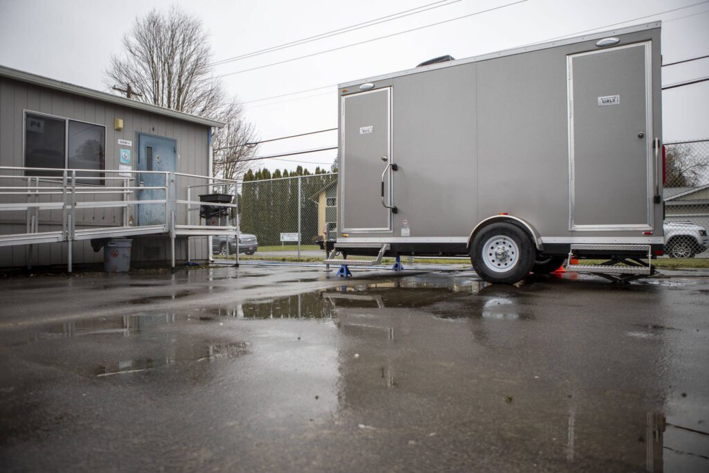 A portable toilet at the Sultan Elementary School on Wednesday, Jan. 24, 2024 in Sultan, Washington. 30 boys used the bathroom in the span of ten minutes resulting in a broken door. (Annie Barker / The Herald)
