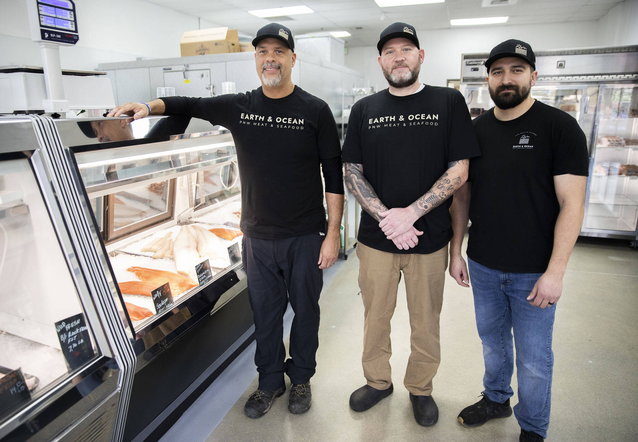 From left, Fermin Lopez, Michael Macready and Chris Mills at Earth and Ocean in Mukilteo. Lopez and Mills are the co-owners; Maccready is the executive chef. (Olivia Vanni / The Herald)