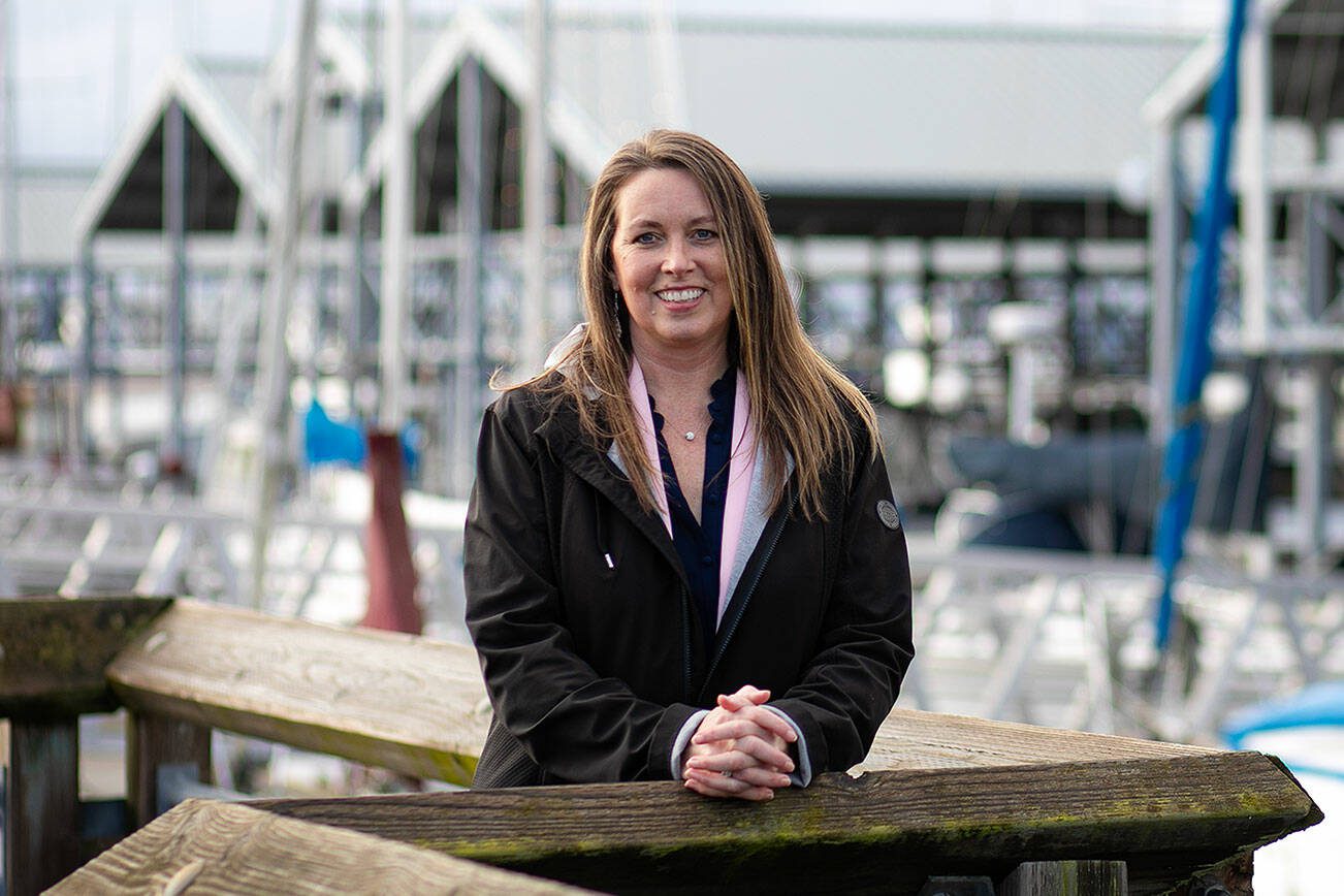 Angela Harris, Executive Director of the Port of Edmonds, stands at the port’s marina on Wednesday, Jan. 24, 2024, in Edmonds, Washington. (Ryan Berry / The Herald)