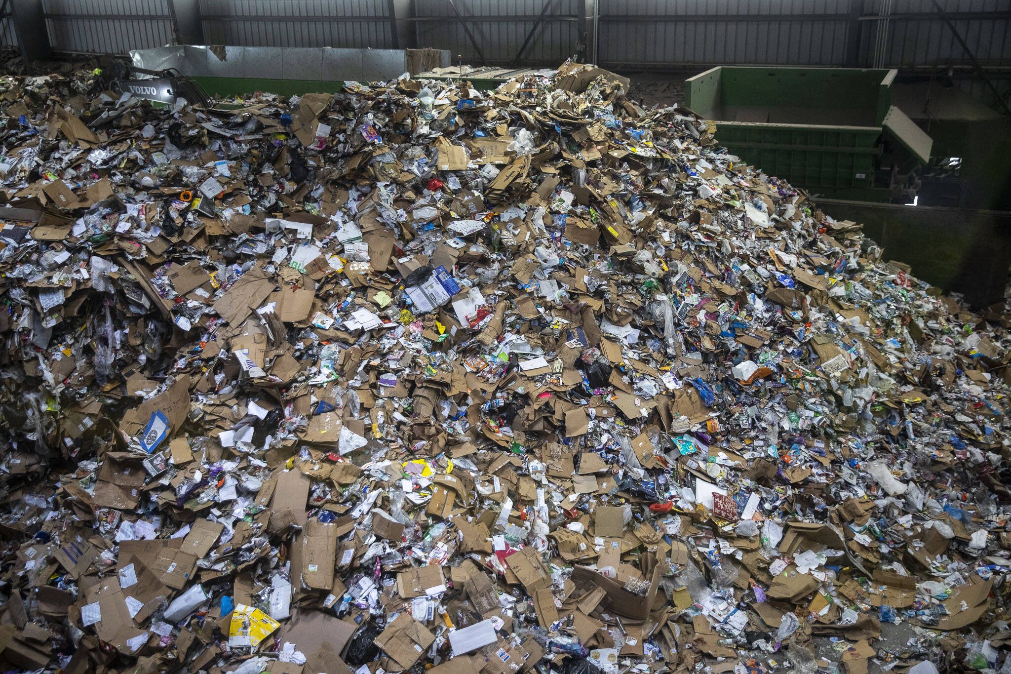 Items are sorted for recycling inside the Waste Management Cascade Recycling Center in Woodinville, Washington on Wednesday, Nov. 1, 2023. (Annie Barker / The Herald)