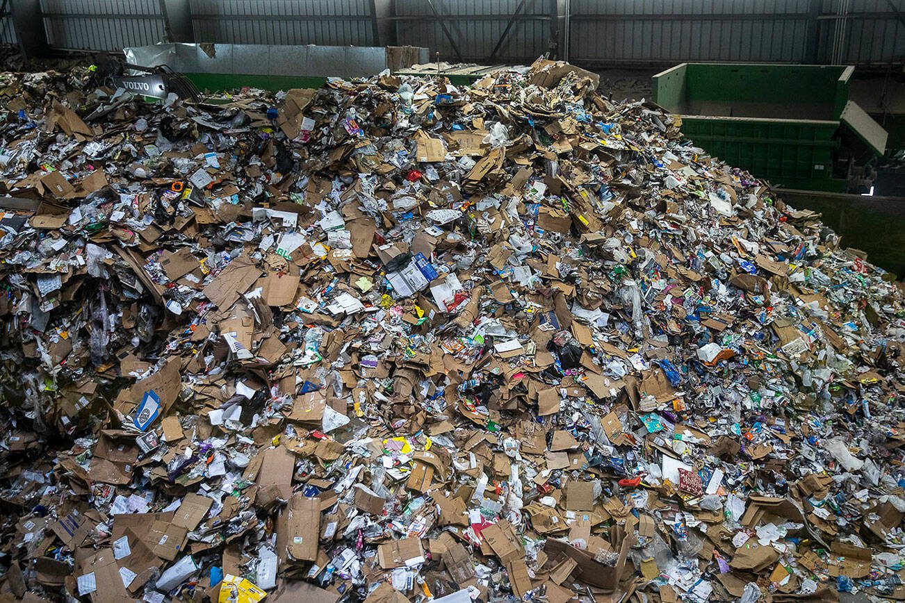 Items are sorted for recycling inside the Waste Management Cascade Recycling Center in Woodinville, Washington on Wednesday, Nov. 1, 2023. (Annie Barker / The Herald)