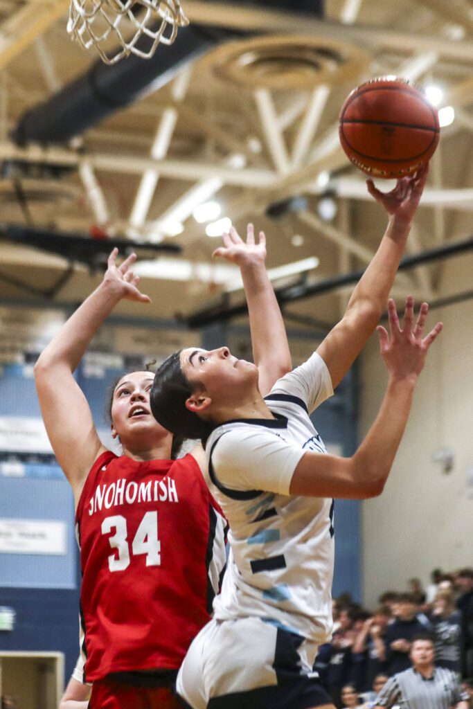 Meadowdale’s Gia Powell (2) shoots the ball during a game against Snohomish on Wednesday at Meadowdale High School in Lynnwood. (Annie Barker / The Herald)
