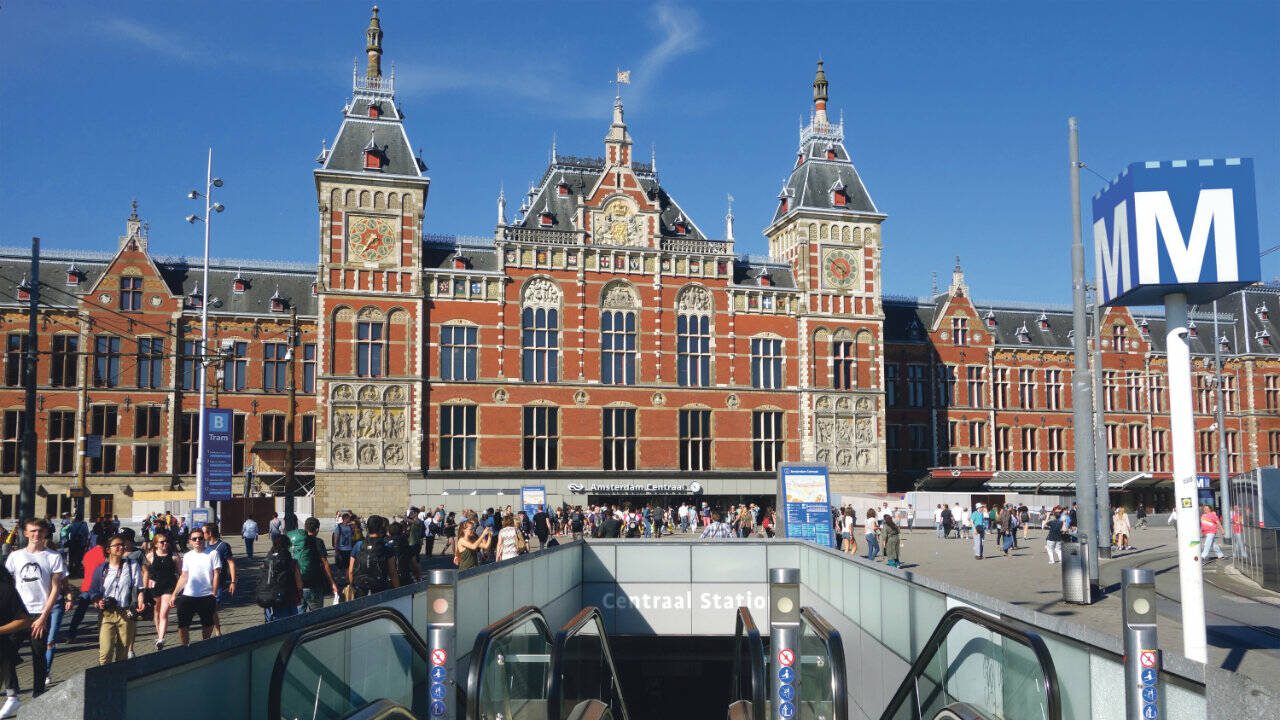 Amsterdam Centraal train station is the starting point for any Amsterdam adventure: history, famous art, or mayonnaise-slathered fries. (Rick Steves’ Europe)