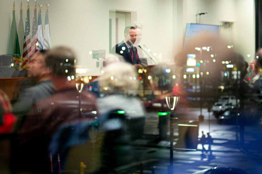 Marysville Mayor Jon Nehring is reflected in the glass of the Marysville Civic Center as he gives the state of the city address on Wednesday, Jan. 31, 2024, in Marysville, Washington. (Ryan Berry / The Herald)
