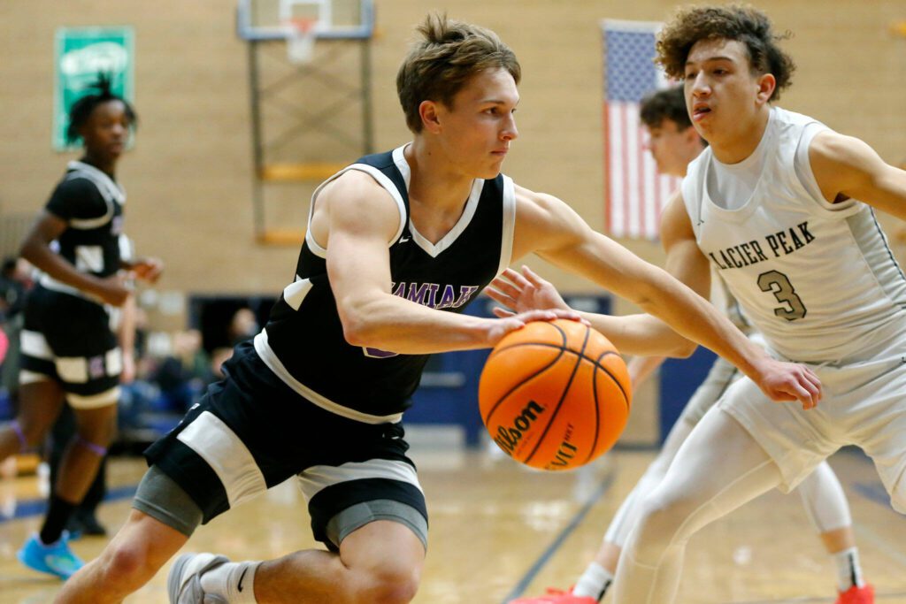 Kamiak’s Daniel Shubert takes the ball to the baseline against Glacier Peak during a 4A boys basketball game on Thursday, Feb. 1, 2024, at Glacier Peak High School in Snohomish, Washington. (Ryan Berry / The Herald)
