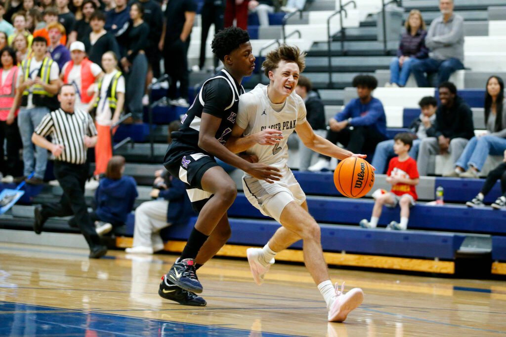 Glacier Peak’s Josiah Lee fights through contact to finish a fast break against Kamiak during a 4A boys basketball game on Thursday, Feb. 1, 2024, at Glacier Peak High School in Snohomish, Washington. (Ryan Berry / The Herald)
