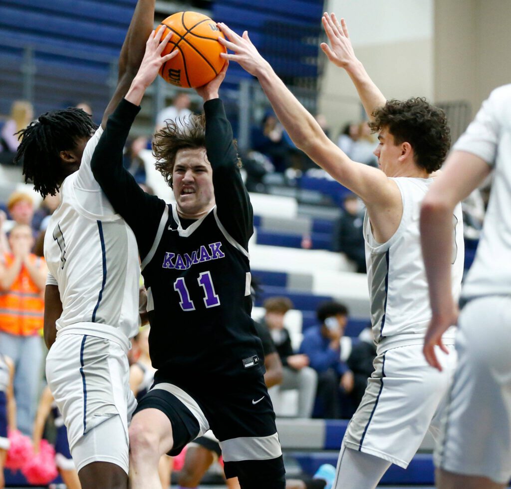 Kamiak’s Alex Lundquist fights through traffic against Glacier Peak during a 4A boys basketball game on Thursday, Feb. 1, 2024, at Glacier Peak High School in Snohomish, Washington. (Ryan Berry / The Herald)
