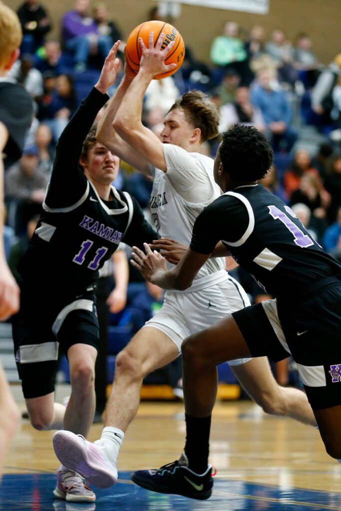 Glacier Peak’s Jo Lee splits the lane against Kamiak during a 4A boys basketball game on Thursday, Feb. 1, 2024, at Glacier Peak High School in Snohomish, Washington. (Ryan Berry / The Herald)
