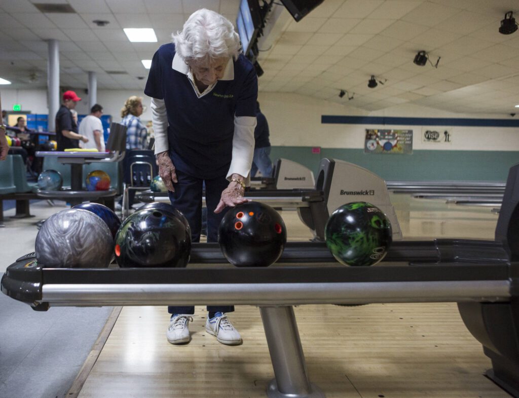 Carol Perry waits for her bowling ball to be returned during league bowling at Strawberry Lanes on Wednesday, Feb. 26, 2020 in Marysville , Wa. (Olivia Vanni / The Herald)
