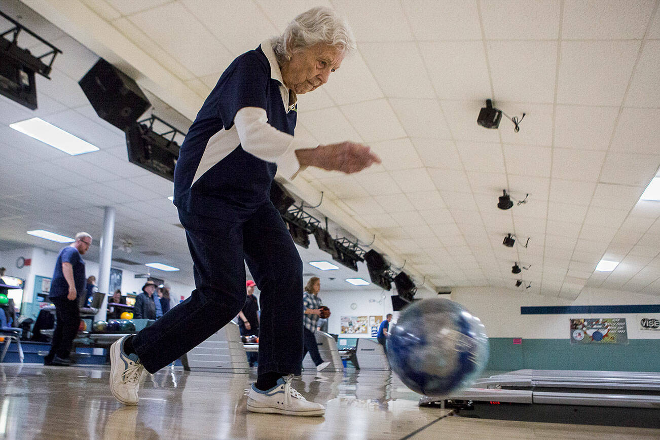 Carol Perry lines bowls during league bowling at Strawberry Lanes on Wednesday, Feb. 26, 2020 in Marysville , Wa. (Olivia Vanni / The Herald)