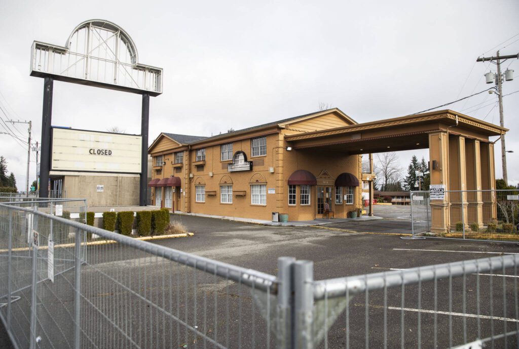 The Days Inn surrounded by fencing on Monday, Feb. 12, 2024 in Everett, Washington. (Olivia Vanni / The Herald)
