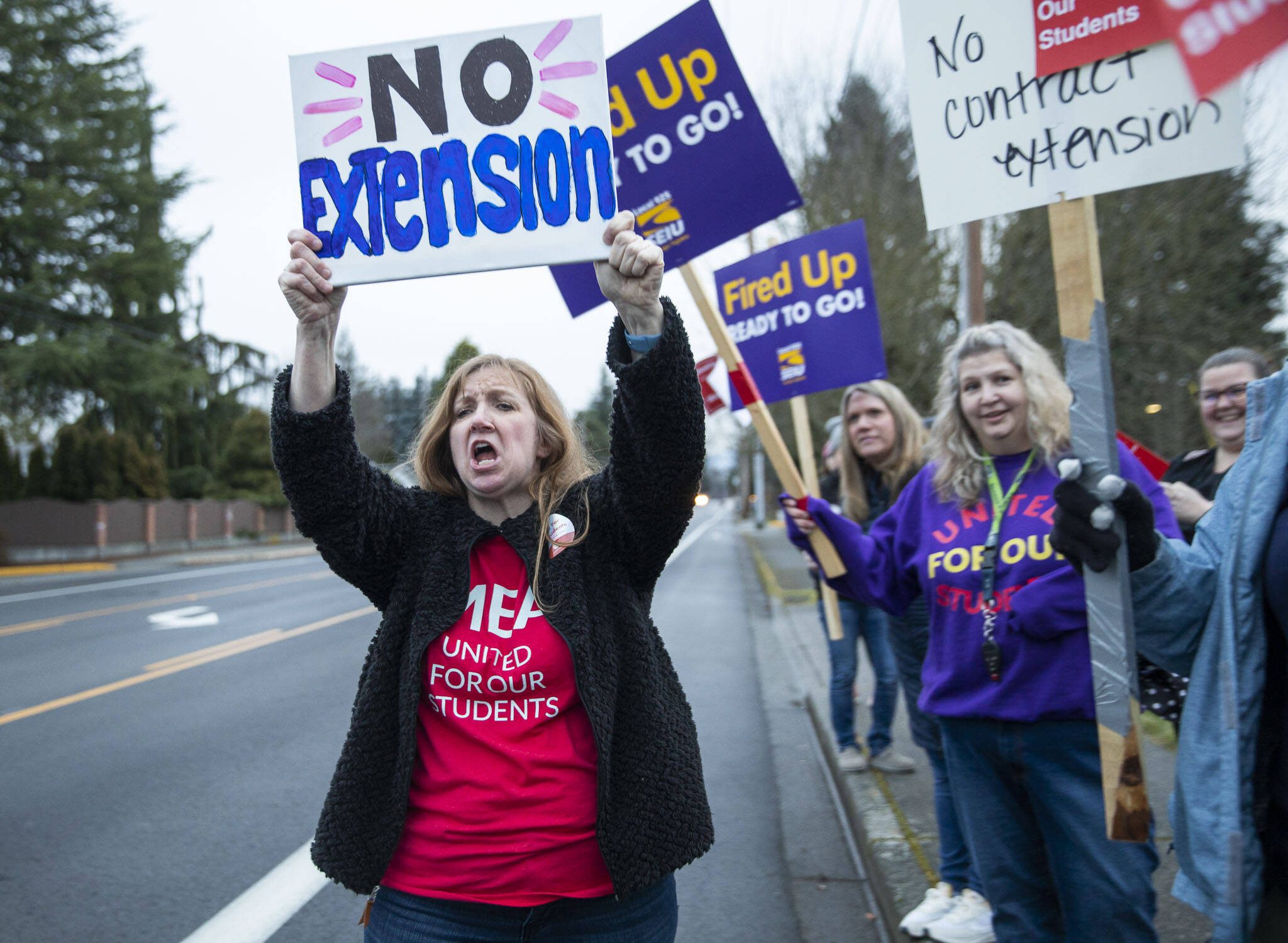 Christine Cobb, a third grade teacher, participates in a no extension chat during a rally before a Marysville School Board meeting on Monday, Feb. 5, 2024 in Marysville, Washington. (Olivia Vanni / The Herald)