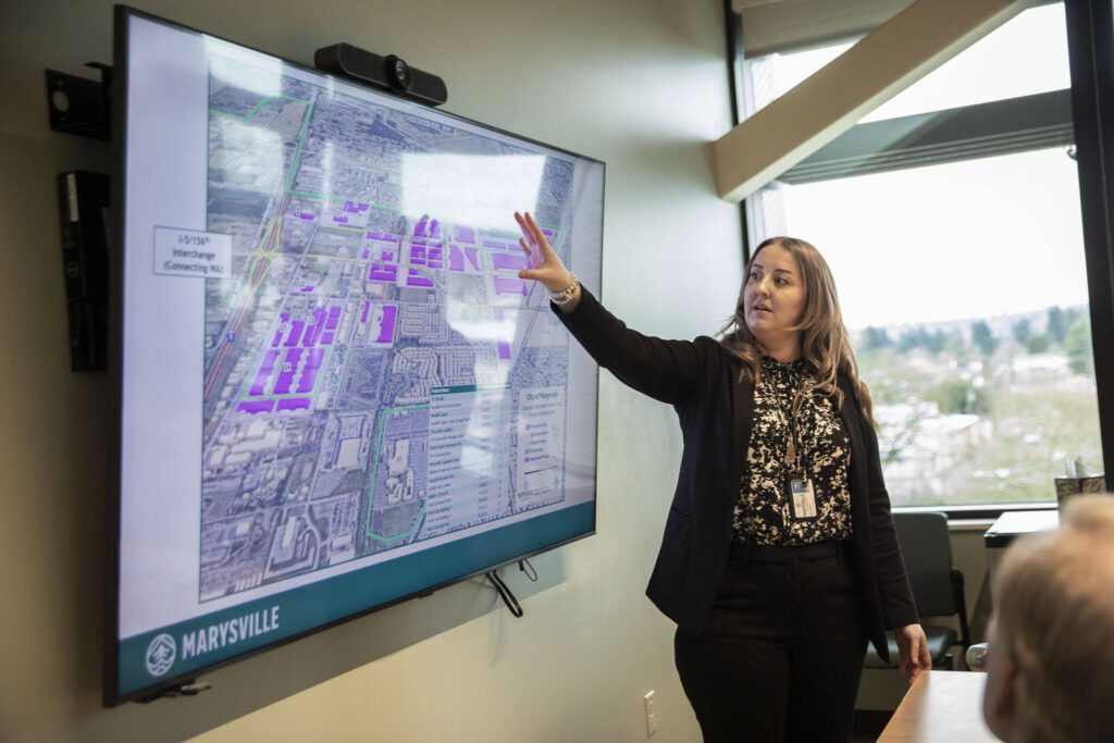 Marysville Community Development Director Haylie Miller talks to Gov. Jay Inslee about the Cascade Industrial Center on Tuesday, Feb. 6, 2024 in Marysville, Washington. (Olivia Vanni / The Herald)
