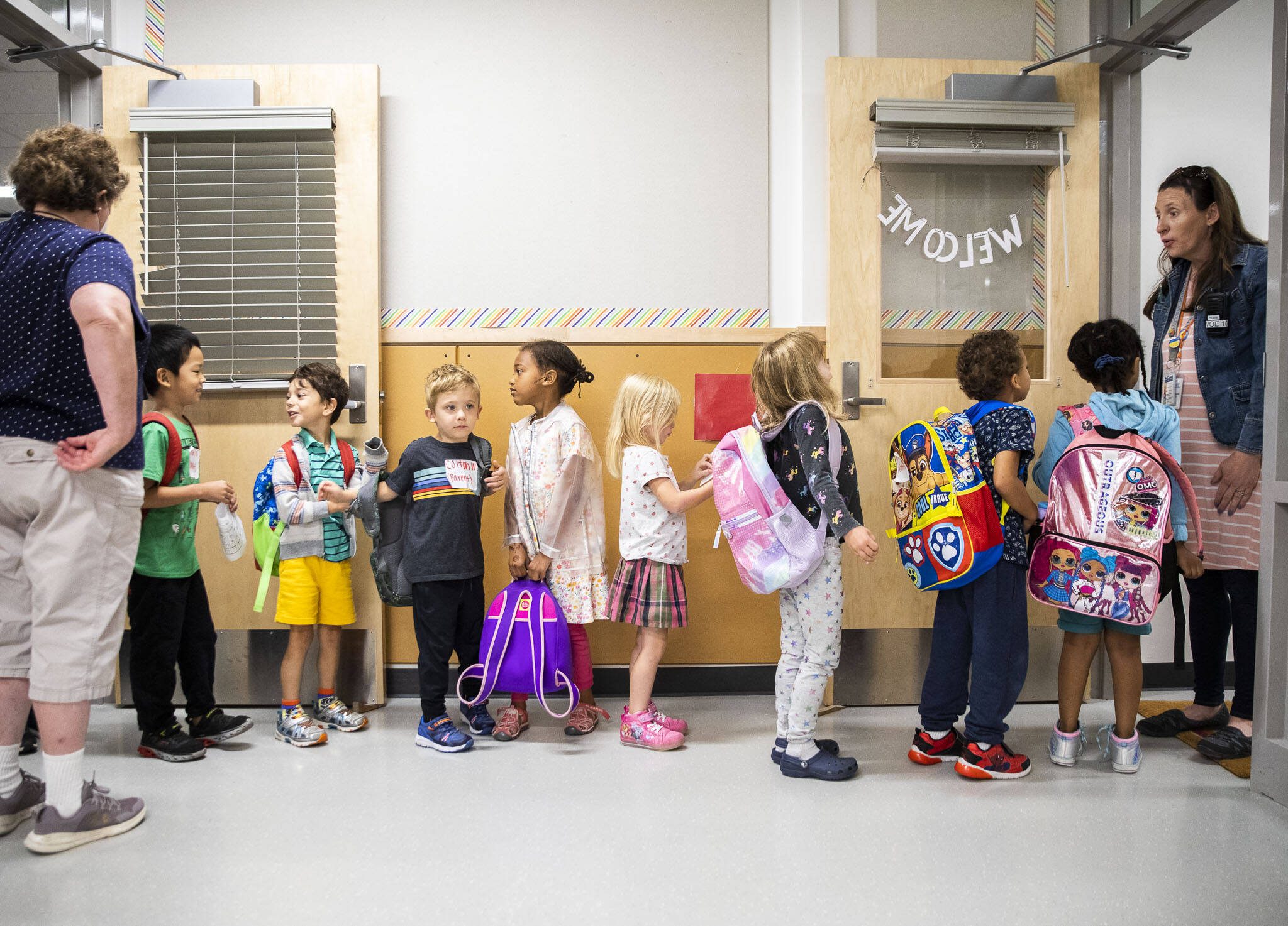 Kindergarteners from around the school district wait to change classrooms at Woodside Elementary School during Everett Ready, a program that helps kindergarteners get familiar with school routines on Friday, Aug. 26, 2022, near Everett, Washington. (Olivia Vanni / The Herald)