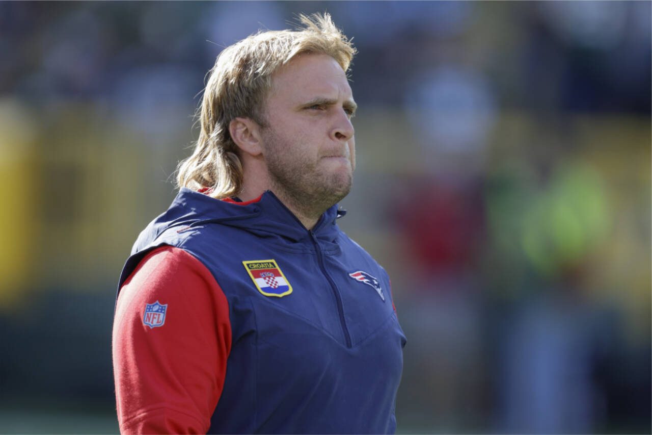Steve Belichick walks on the field before an NFL game Oct. 2, 2022, in Green Bay, Wis. Belichick is joining Washington’s staff as defensive coordinator after spending the past 12 seasons on coaching staff of the New England Patriots. (AP Photo/Matt Ludtke)