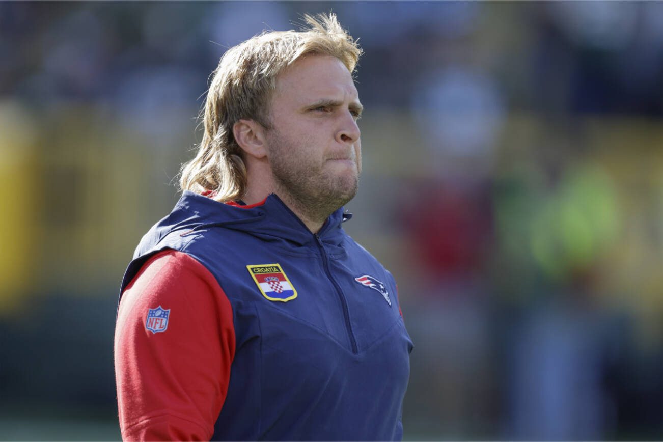 New England Patriots linebackers coach Steve Belichick walks on the field before an NFL football game against the Green Bay Packers Sunday, Oct. 2, 2022, in Green Bay, Wis. (AP Photo/Matt Ludtke)