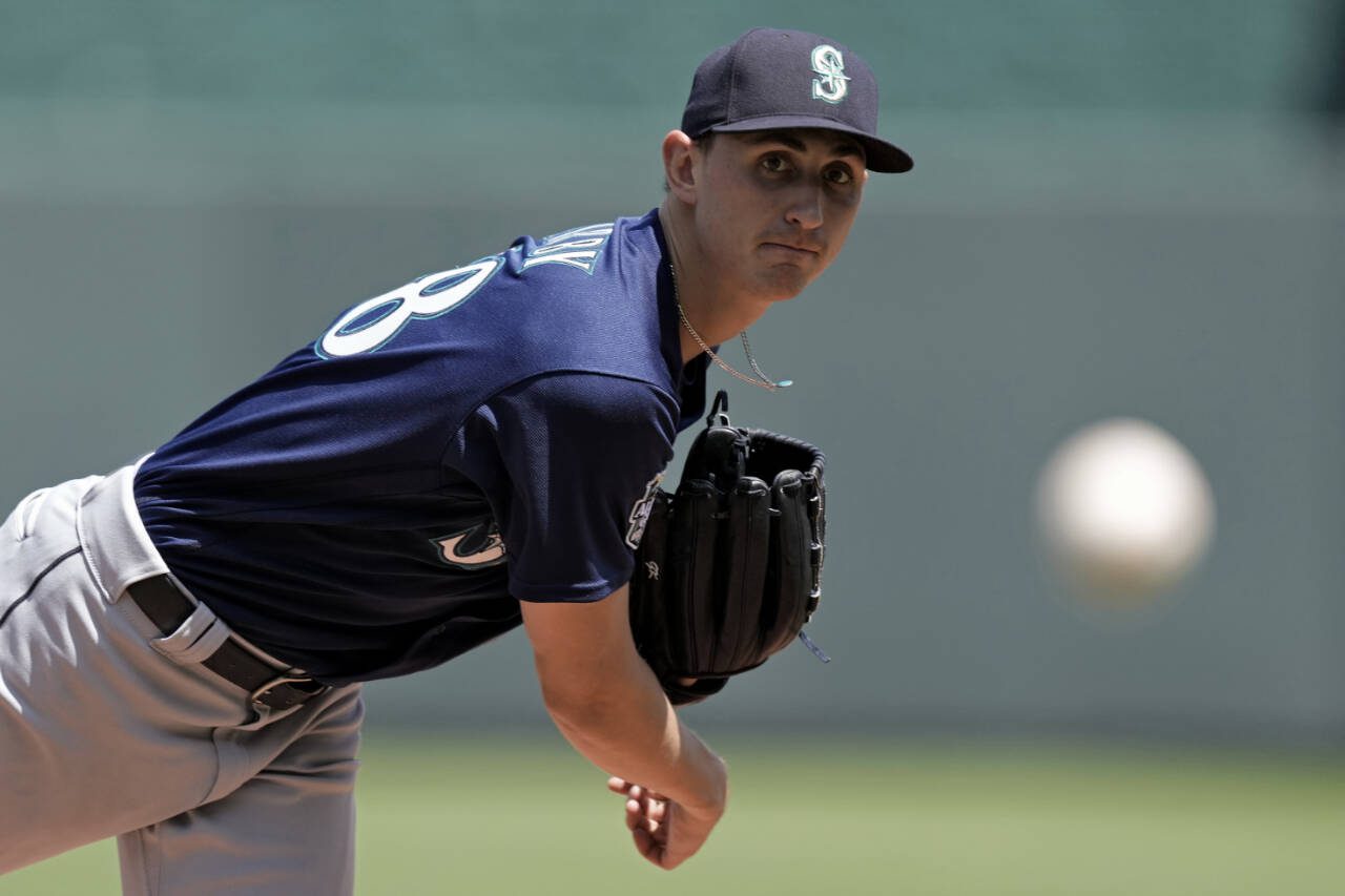 Seattle Mariners starting pitcher George Kirby pitches during a game against the Kansas City Royals on Aug. 17, 2023, in Kansas City, Mo. (AP Photo/Charlie Riedel)