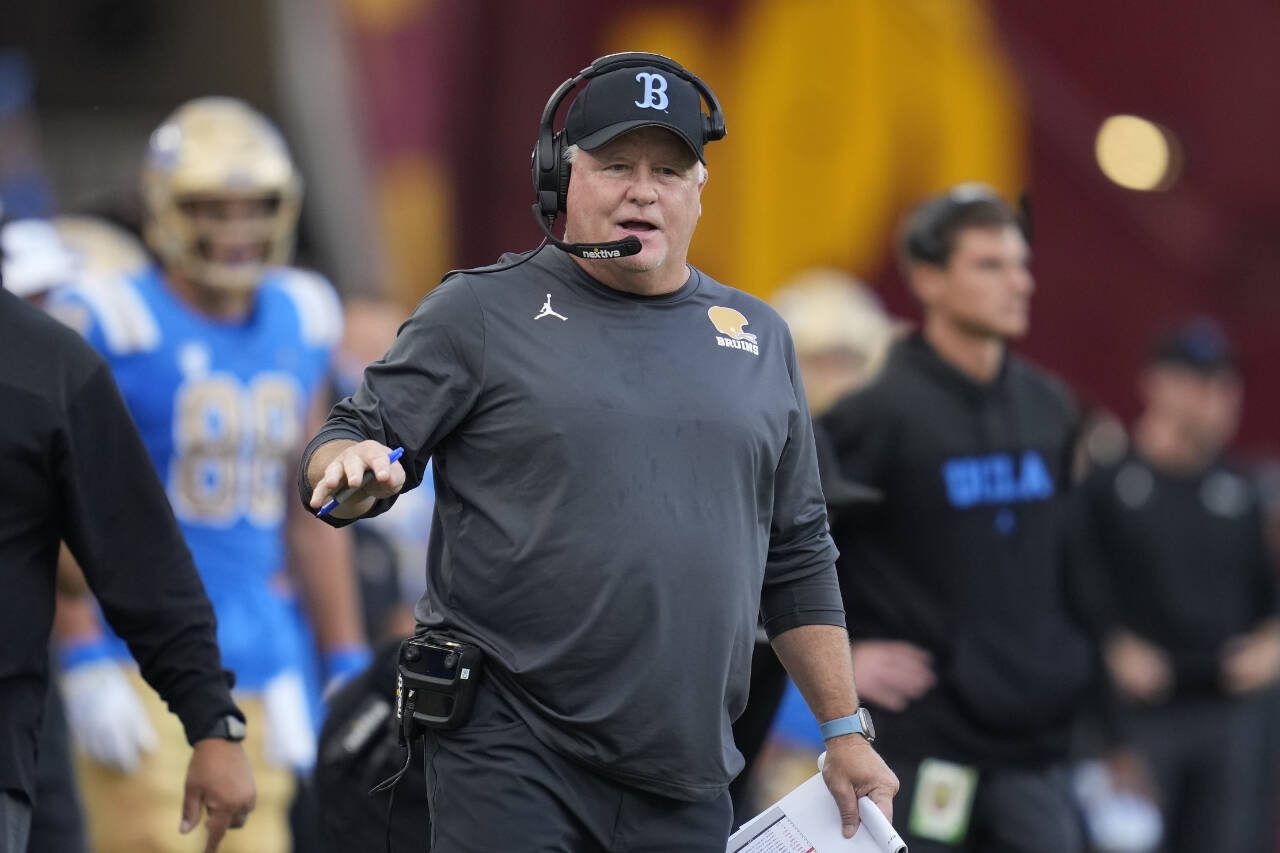 UCLA head coach Chip Kelly stands on the sideline during a game against Southern California in Los Angeles on Nov. 18, 2023. (AP Photo/Ashley Landis)