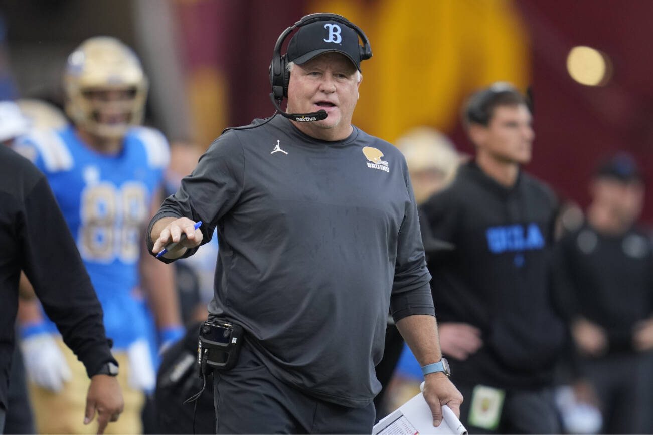 UCLA head coach Chip Kelly stands on the sideline during the first half of an NCAA college football game against Southern California in Los Angeles, Saturday, Nov. 18, 2023. (AP Photo/Ashley Landis)