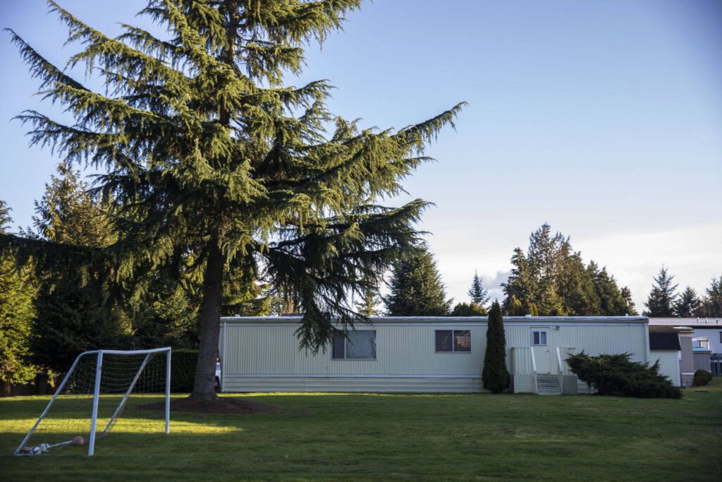 A large open space with a goal for children to play and people to walk their dogs at Sherwood Village on Tuesday, Feb. 13, 2024 in Mill Creek, Washington. (Olivia Vanni / The Herald)
