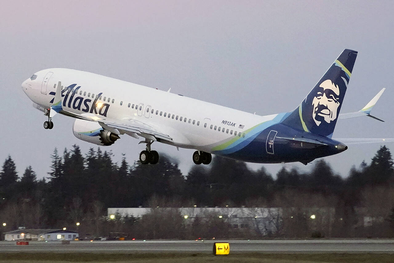The first Alaska Airlines passenger flight on a Boeing 737-9 Max airplane takes off on a flight to San Diego from Seattle-Tacoma International Airport in Seattle on March 1, 2021. (Ted S. Warren / Associated Press file)