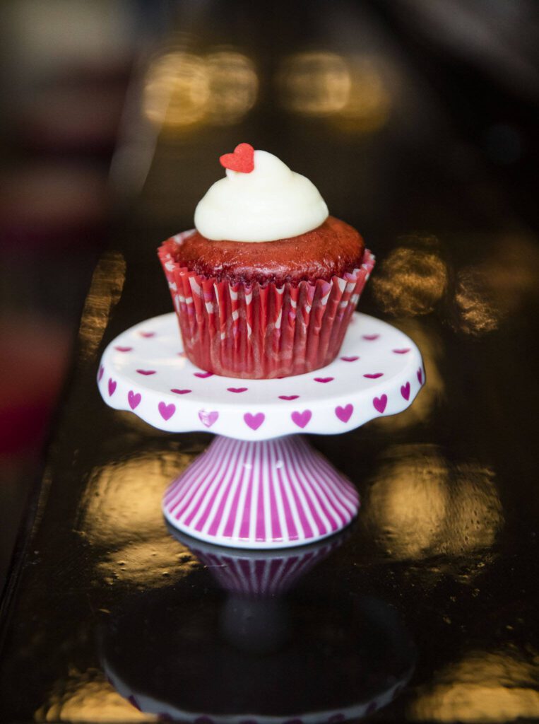 A red velvet cupcake with cream cheese frosting from Mom and Pops Cakery on Wednesday, Feb. 14, 2024 in Everett, Washington. (Olivia Vanni / The Herald)
