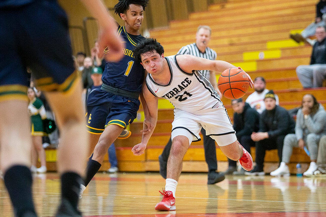 Mountlake Terrace’s Logan Tews takes the ball down the court during the game against Shorecrest on Tuesday, Feb. 13, 2024 in Marysville, Washington. (Olivia Vanni / The Herald)