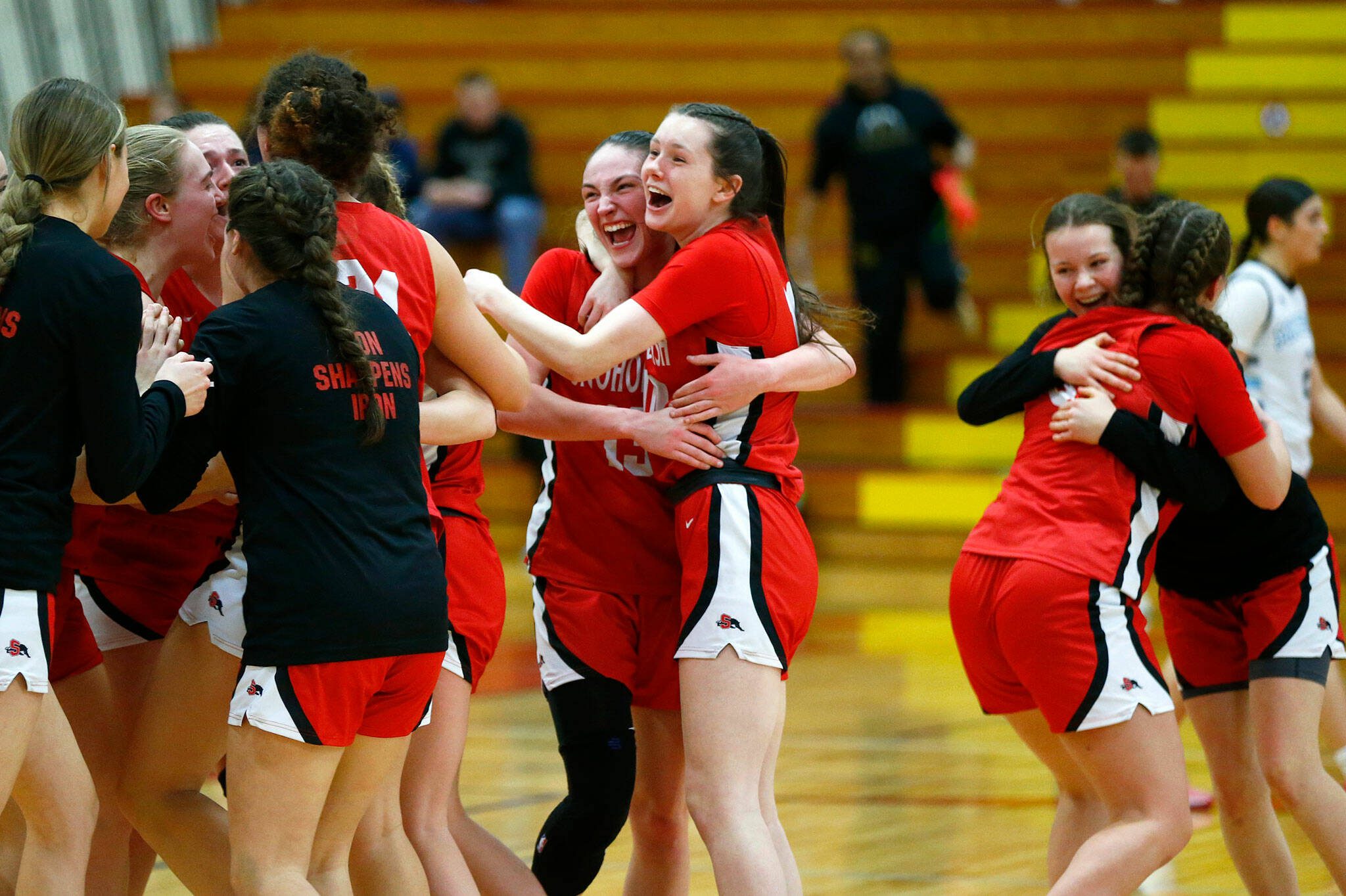 The Snohomish Panthers celebrate their win over Meadowdale during the 3A District 1 semifinals on Wednesday at Marysville Pilchuck High School in Marysville. (Ryan Berry / The Herald)