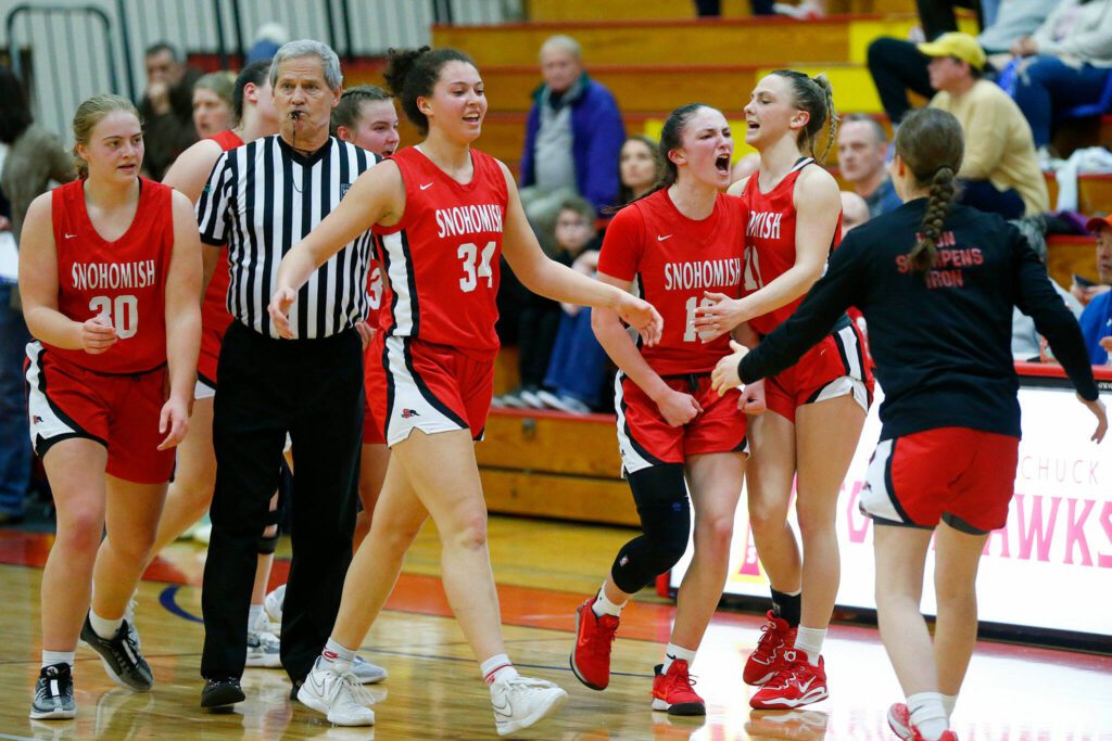 Snohomish players celebrate a strong run against Meadowdale as they head for the bench during the 3A District One Semifinals on Wednesday, Feb. 14, 2024, at Marysville Pilchuck High School in Marysville, Washington. (Ryan Berry / The Herald)
