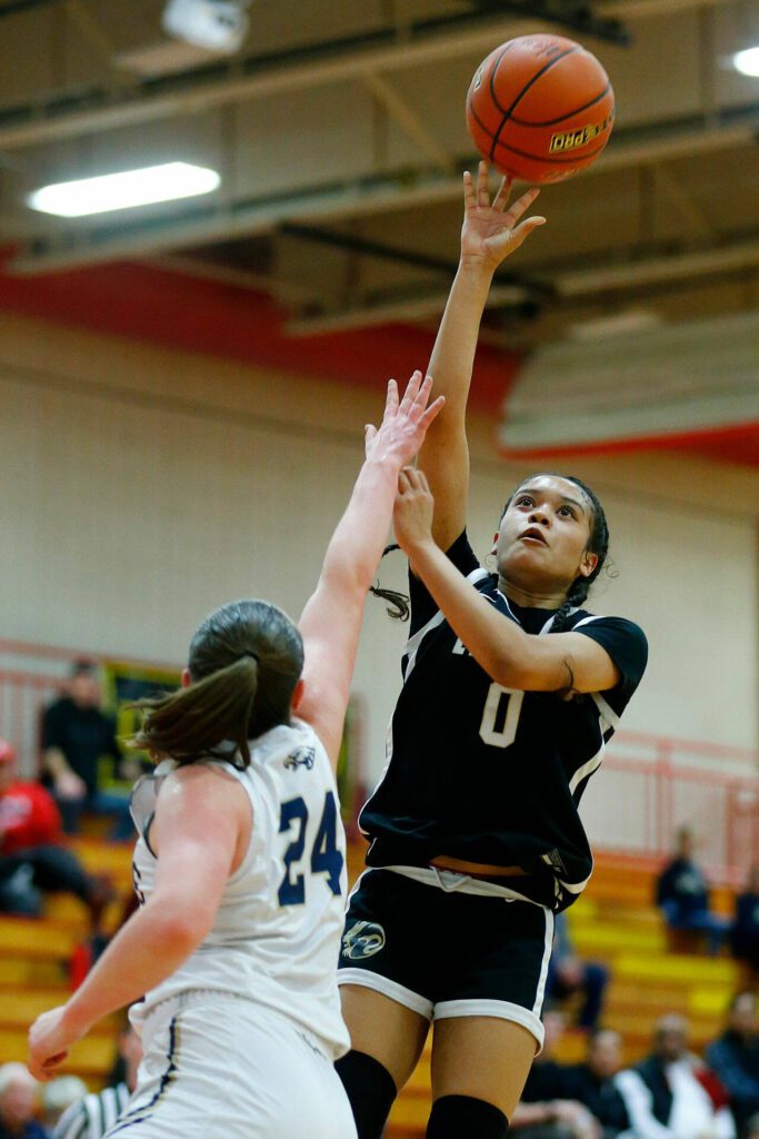 Lynnwood’s Aniya Hooker pulls up for a shot against Arlington during the 3A District One Semifinals on Wednesday, Feb. 14, 2024, at Marysville Pilchuck High School in Marysville, Washington. (Ryan Berry / The Herald)

