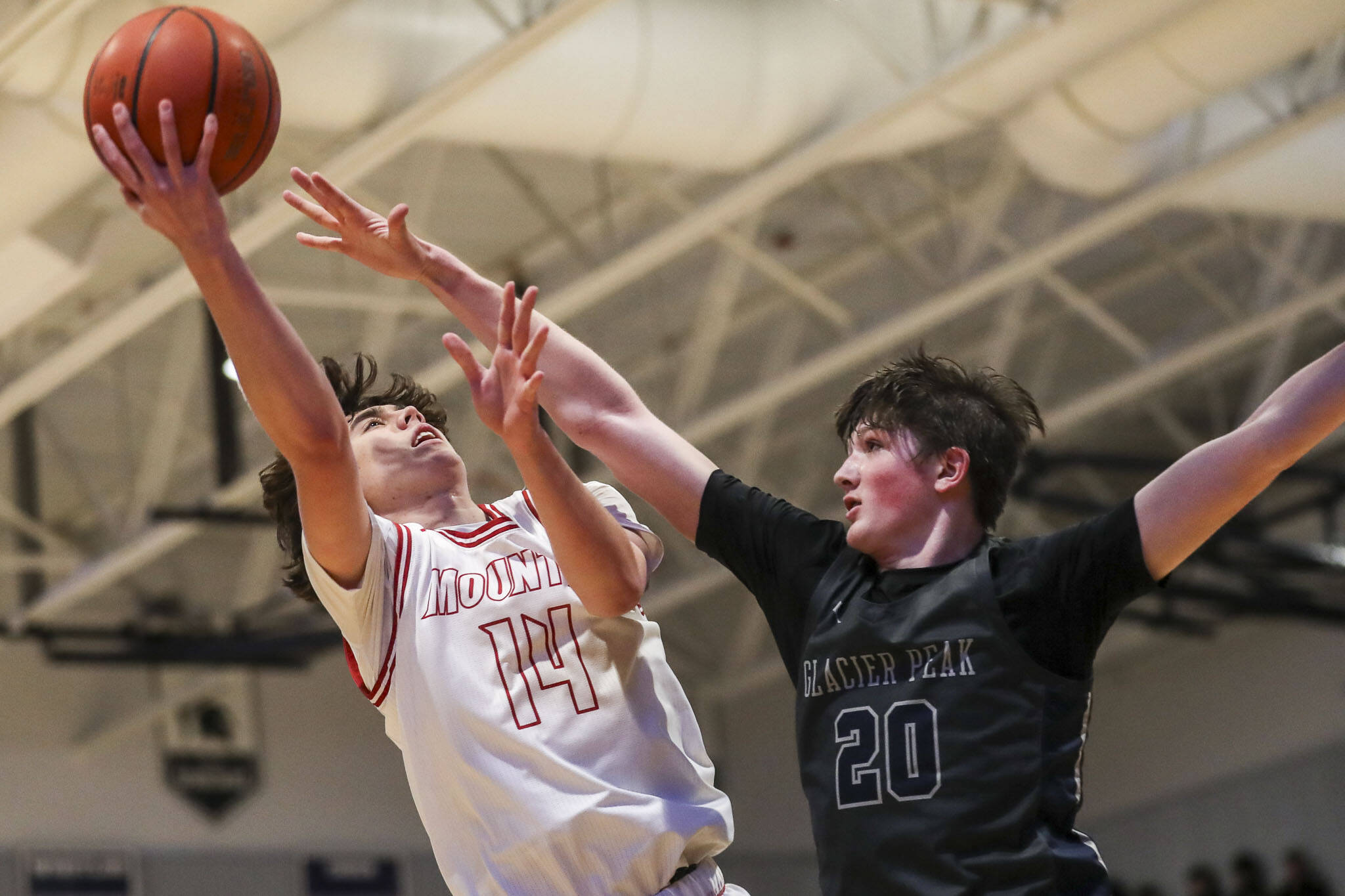 Mount Si’s Marcus Heide (14) shoots the ball during a boys Class 4A bi-district title game between Glacier Peak and Mount Si at North Creek High School on Friday, Feb. 16, 2024 in Bothell, Washington. The Wildcats won, 59-53.(Annie Barker / The Herald)