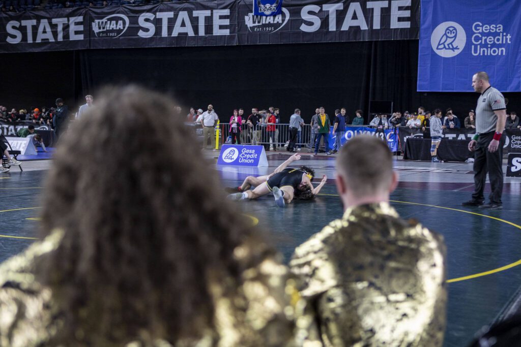 Athletes wrestle during Mat Classic XXXV on Saturday, Feb. 17, 2024, at the Tacoma Dome in Tacoma. (Annie Barker / The Herald)
