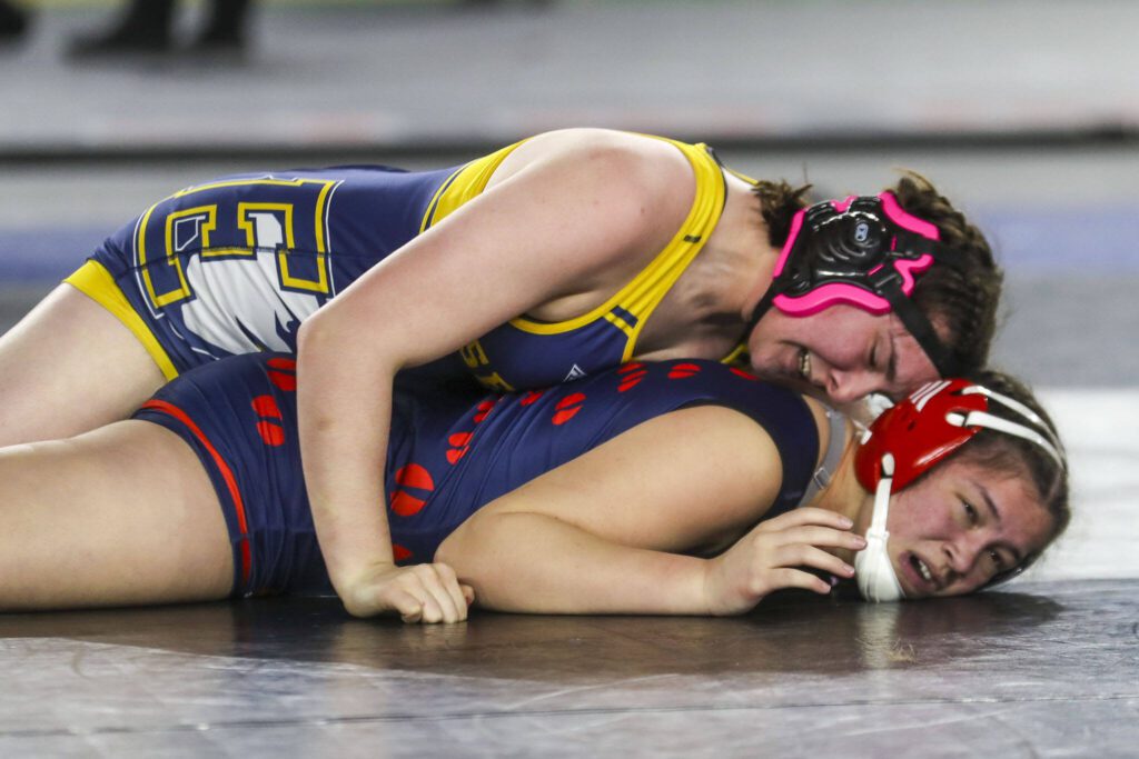 Everett’s Mia Cienega xnamex and Silas’ Tru Willis wrestle during the 4A/3A girls 190-pound championship match during Mat Classic XXXV on Saturday, Feb. 17, 2024, at the Tacoma Dome in Tacoma. (Annie Barker / The Herald)
