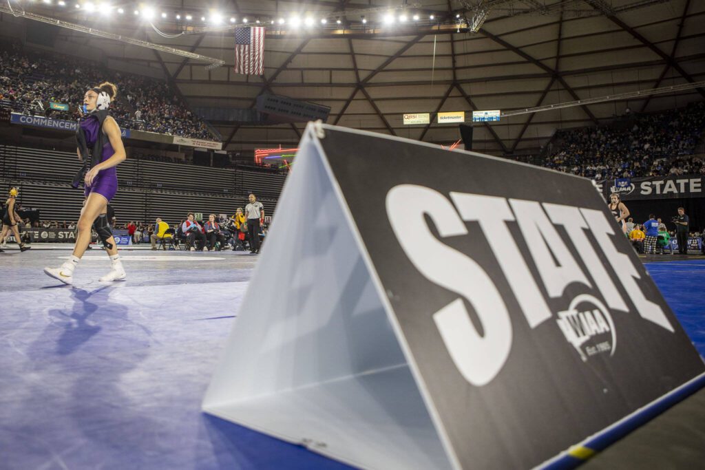 Lake Stevens’ Kamryn Mason prepares to wrestle Moses’ Lake Ashley Naranjo in the 4A/3A girls 110-pound championship match during Mat Classic XXXV on Saturday, Feb. 17, 2024, at the Tacoma Dome in Tacoma. (Annie Barker / The Herald)
